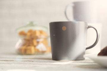 Obraz na płótnie Canvas Cup of tea or coffee on modern kitchen background