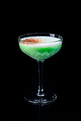classic grasshopper cocktail with reflection on a dark background