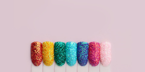 Nail art in rainbow colors, glitter and sequins. Nail tips collection, salon advertisement