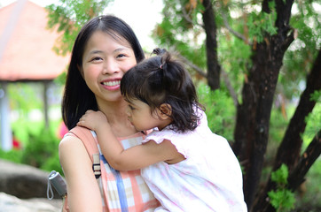 Little Child Girl and Mother at The Public Park