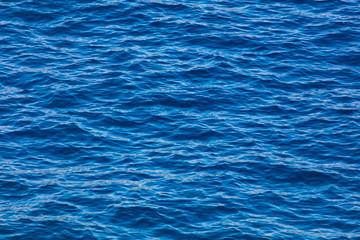 Blue expanse of water at sea as abstract background