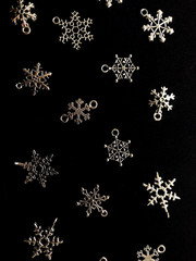 Christmas snowflakes on black background.