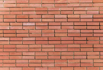 Red bricks in the wall of the house