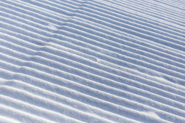 White snow on the roof of the house as an abstract background