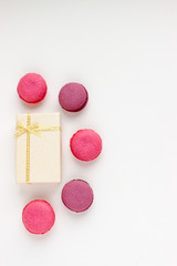 French Pink Macaroons on White Background. Top View Traditional Dessert for Feminine Design. Confectionery, Fashion, Beauty Advertising Template.