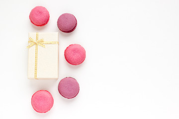 French Pink Macaroons on White Background. Top View Traditional Dessert for Feminine Design. Confectionery, Fashion, Beauty Advertising Template.