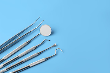 dental tools on blue background top view