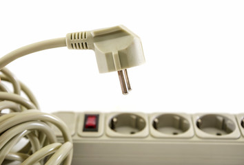 gray extension cord isolated on a white background. Close-up.