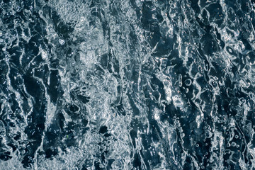 Blue and turquoise water with irregular wave structure