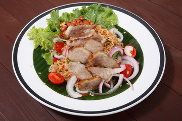 Hot and Spicy Sour Grill Pork with Instant Noddle Thai Salad. Thai Street Food.