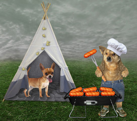 The dog in a chef hat, shorts and sneakers cooks the grilled sausages near the tent with his friend...