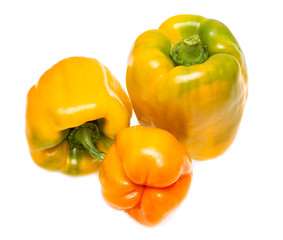 yellow and red bell peppers on a white background