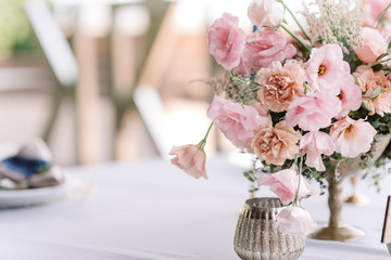 Beautiful wedding background. Flowers in an antique vase. Elegant natural flowers