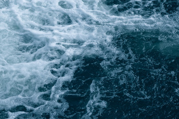 Fototapeta premium Blue and turquoise water with irregular wave structure