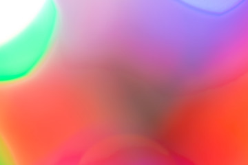 Blurred and defocused abstract multicolor background with christmas lights, soft multicolored bokeh circles
