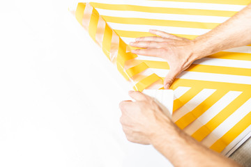 Wrapping with adhesive foil .Advertising studio. Sticking with self-adhesive foil.
