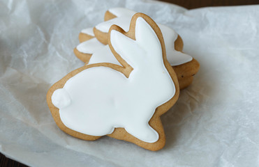 Christmas gingerbread in the form of a rabbit on a paper background