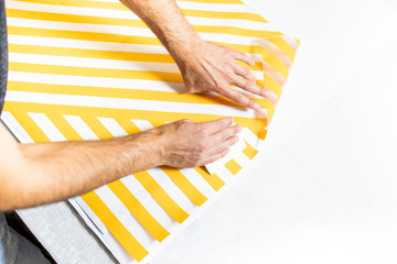 Advertising studio. Sticking with self-adhesive foil. Wrapping