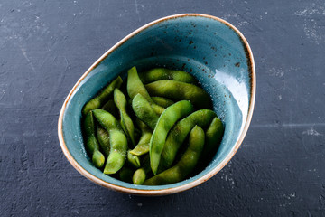Green beans are the unripe fruit common bean (Phaseolus vulgaris), green string bean dish top view