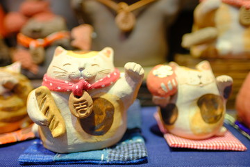 Cute Japanese style lucky cat ceramic decoration of holiday celebration