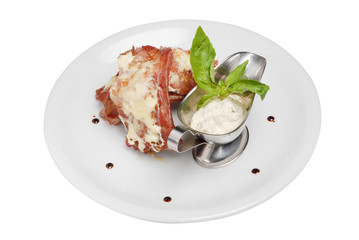 Steak, rib meat and white sauce on white plate on white isolated background