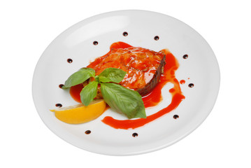Boiled fish with home made tomato sauce on a white isolated background