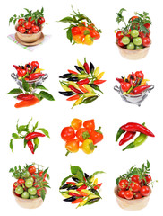 fresh cherry tomatoes with green leaves and pile of various kind of chilli peppers isolated on white background