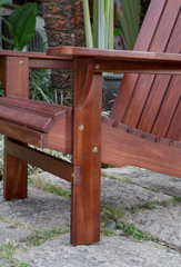 The detail of red rocking chair in the backyard