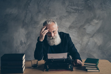 Portrait of his he nice attractive content dreamy bearded gray-haired top professional publisher...