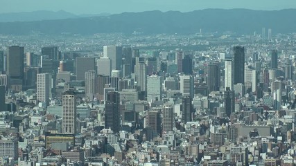 OSAKA, JAPAN - CIRCA SEPTEMBER 2019 : Aerial high angle view of CITYSCAPE of OSAKA in daytime. Osaka is the second largest metropolitan area in Japan. Time lapse shot.