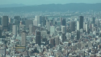 OSAKA, JAPAN - CIRCA SEPTEMBER 2019 : Aerial high angle view of CITYSCAPE of OSAKA in daytime. Osaka is the second largest metropolitan area in Japan. Time lapse shot.