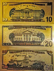 Souvenir American Gold Heap of Dollar Bills golden background.