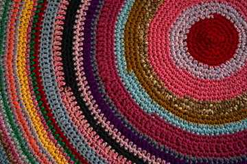 Background, texture old multicolored Oriental rug. Top view. Concept needlework, knitting, weaving