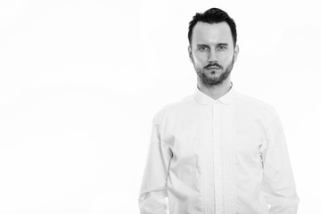 Studio portrait of young handsome man shot in black and white