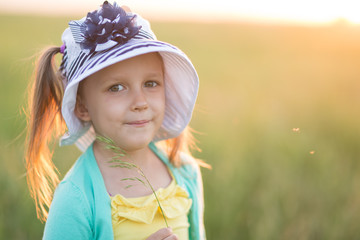 girl of five years on a meadow