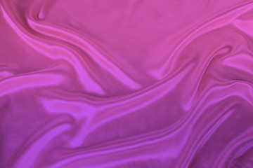 soft folds on delicate pink, lilac shining silk, luxury concept, background for the designer, horizontal, close-up, copy space