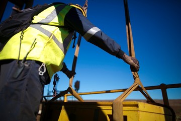 Rigger inspector holding lifting sling on the load and commencing final safety inspection checking...