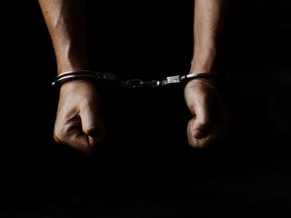 prisoner concept,Handcuffed hands of a prisoner in prison, Male prisoners were severely strained in...