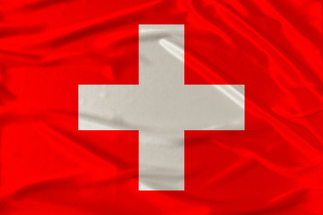 national flag of switzerland on delicate silk with wind folds, travel concept, immigration, politics
