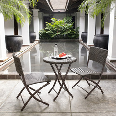 The net table and chairs in the backyard.