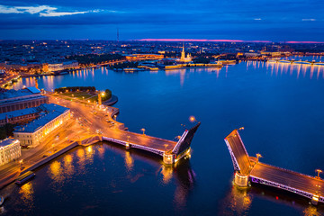 Panorama of St. Petersburg from a height. Russia. Illuminated by the lights of the city centre. Rivers Of Petersburg. Bridges Of Petersburg. Palace bridge across the Neva divorced. Vasilievsky island