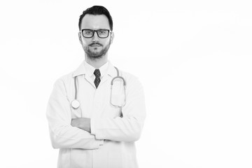 Fototapeta premium Studio shot of young man doctor with arms crossed
