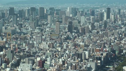OSAKA, JAPAN - CIRCA SEPTEMBER 2019 : Aerial high angle view of CITYSCAPE of OSAKA in daytime. Osaka is the second largest metropolitan area in Japan. Zoom out shot.