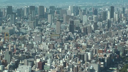 OSAKA, JAPAN - CIRCA SEPTEMBER 2019 : Aerial high angle view of CITYSCAPE of OSAKA in daytime. Osaka is the second largest metropolitan area in Japan. Zoom out shot.