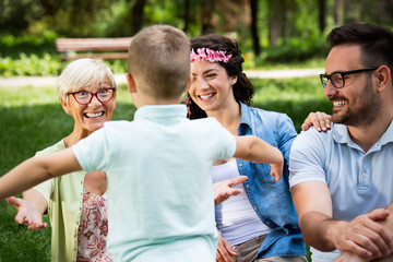 Multi generation family enjoying picnic in a park