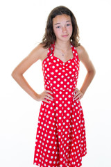Unhappy dissatisfied young woman in red summer dress standing teen girl feels disappointed isolated over white background