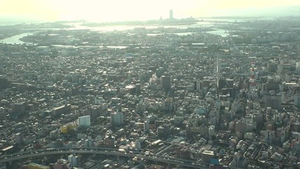 OSAKA, JAPAN - CIRCA SEPTEMBER 2019 : Aerial high angle view of CITYSCAPE of OSAKA in early evening sunset time. Osaka is the second largest metropolitan area in Japan.