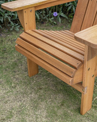 The detail of wood beach chair in the backyard.