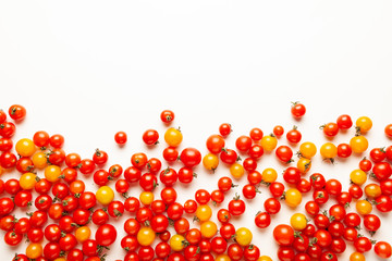 Red and yellow cherry tomatoes isolated on white background. Fresh bright organic vegetables.