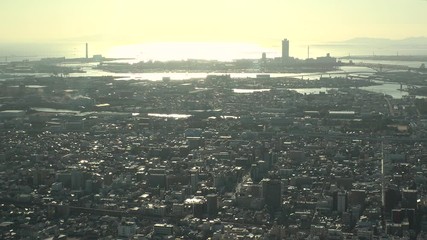 OSAKA, JAPAN - CIRCA SEPTEMBER 2019 : Aerial high angle view of CITYSCAPE of OSAKA in early evening sunset time. Osaka is the second largest metropolitan area in Japan.